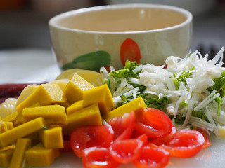 Closeup of hands of chef cook cutting vegetables