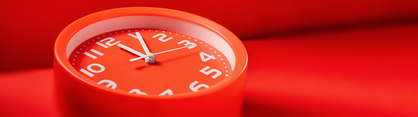 Red clock showing twelve o'clock five minutes web banner with copy space