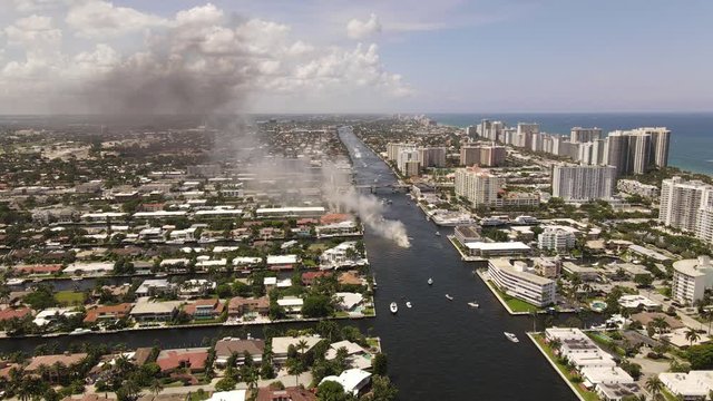 Aerial static shot boat on fire Intracoastal Fort Lauderdale FL