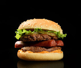 Burger cheeseburger bbq sandwich with beef cheese and fresh vegetables hot with steam smoke on black