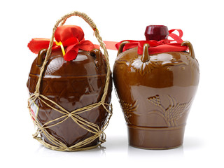 rice wine jar with ceramic bowl on white background