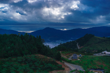 Mountain village covered by clouds