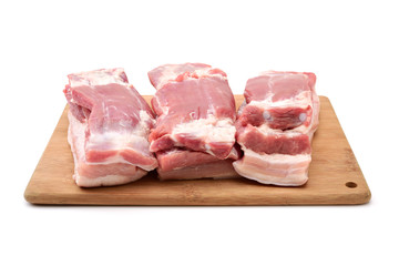 Raw pork belly pieces on a white background