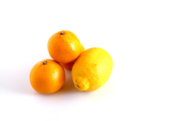 Tangerines and lemon on a white background. Citrus fruits are useful. Vitamin complex