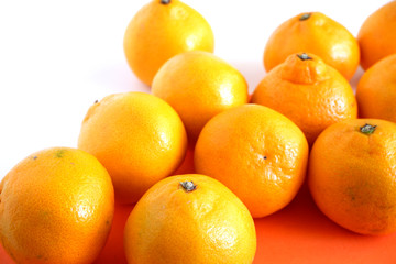 Background of juicy tangerine fruits on a white background.Fruit. Backgrounds