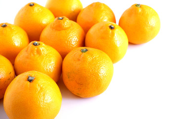 Background of juicy tangerine fruits on a white background.Fruit. Backgrounds