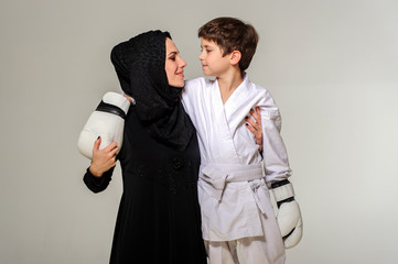 Portrait of motherand her chempion boxer son.