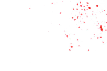Splashes of small drops of red wine on a white background isolated