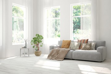White living room with sofa and summer landscape in window. Scandinavian interior design. 3D illustration