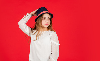 Fancy girl. Spring outfit. Individual style. Girl wear hat red background. Happy kid in hat. Fashion accessory. Summer accessory collection. Child wear hat. Accessories shop. Protect scalp sun rays