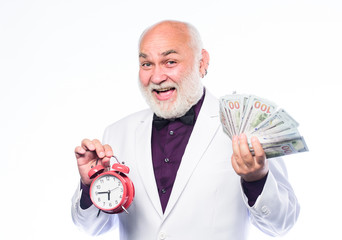 Time is money. Senior man pensioner hold cash money and clock. Successful businessman. Earn money...