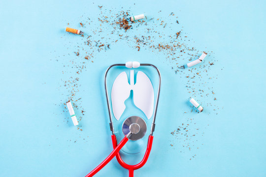 Stethoscope protect the lungs from cigarette on light blue background. Stop smoking. World No Tobacco Day concept.