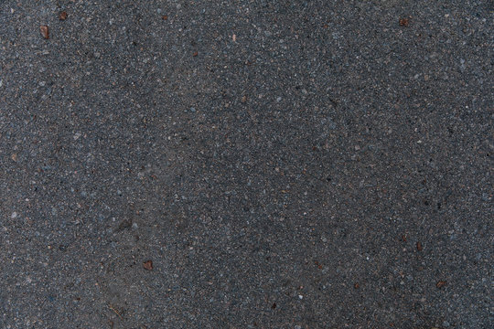 texture of real old dark asphalt, real photo of asphalt surface
