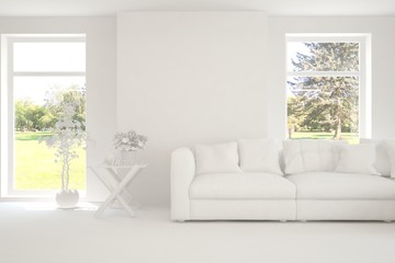 Fototapeta premium White minimalist living room with sofa. Scandinavian interior design. 3D illustration