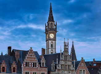 Fototapeta na wymiar Gent. Clock tower at sunset.