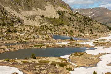 Fototapeta na wymiar Lake in the circuit of Lake Pessons Grau Roig, Andorra.