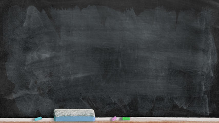 an empty blackboard with some chalks and eraser underneath
