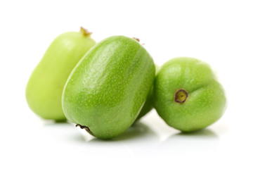 mini kiwi baby fruit (actinidia arguta) on white background 