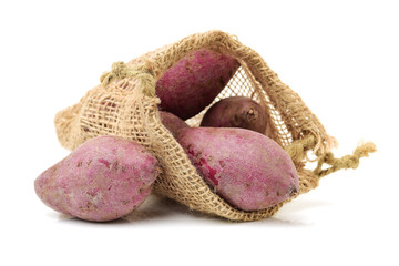Purple Colored Sweet Potatoes on White background