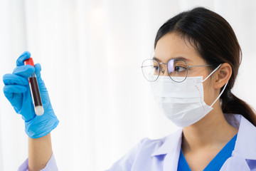 Technician scientist analyzing a blood sample in laboratory, Virus analysis.