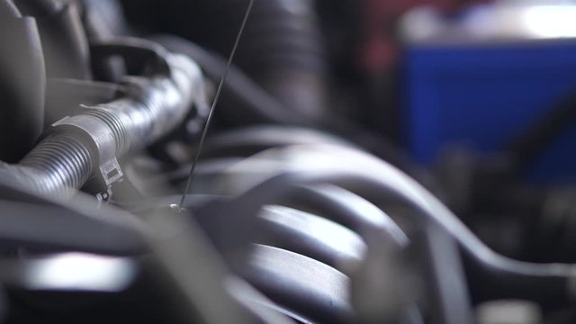 Services car engine machine concept, Automobile mechanic repairman hands repairing a car engine automotive workshop with a wrench, car service and maintenance.