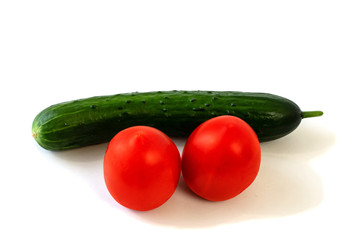 Isolated on white background cucumber and tomato