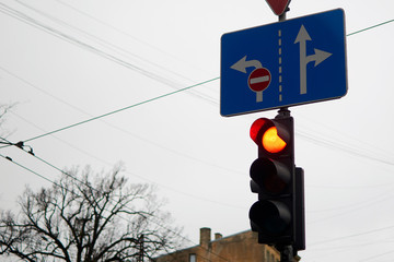 Traffic light red on a city street.