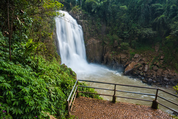 Landscape of peaceful waterfall in the tropical rainforest