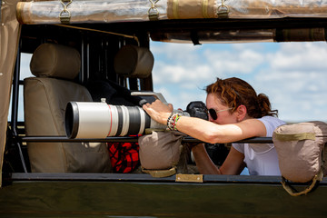Professional female photographer on safari © Rixie
