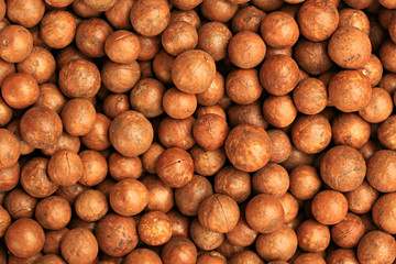 Macadamia nuts slide whole and chopped background 