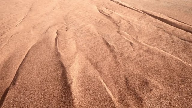 High angle view of sand flowing in desert on sunny day, full frame shot of sand dune - Namib Desert, Namibia