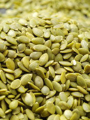 Macro background texture of green pumpkin seeds