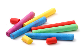 chalks in a variety of colors arranged on a white background
