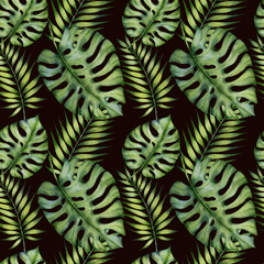 Fototapeta na wymiar Watercolor seamless pattern with tropical leaves on the black background.Hand painted watercolor clipart.