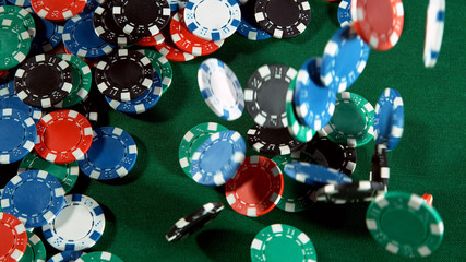 Poker still life with falling poker chips