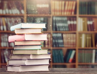 The stack of study books in the library on the table.