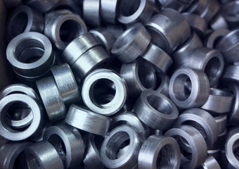 industrial background. cylindrical metal details on grey background