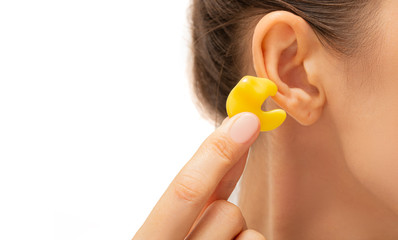 earplugs for noisy places, personally molded earplugs on ear close-up