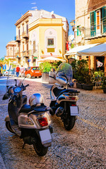 Scooter in the street of Monreale town Sicily reflex