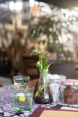 still life with flowers and bottle on the table