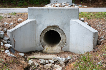 Precast formed concrete headwall for drainage pipe under a street, rainwater runoff culvert,...