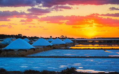 Sunset at salt evaporation pond Marsala Sicily reflex