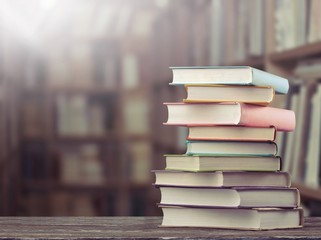 The stack of study books in the library on the table.