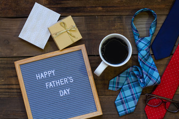 Father's Day Concept with Gifts, Ties, Coffee on Wood Background