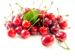 Fototapeta na wymiar heap of ripe tasty cherries isolated on white background