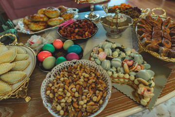 Traditional Azerbaijan holiday Nowruz cookies, baklava, other sweets on the table for celebration. - obrazy, fototapety, plakaty