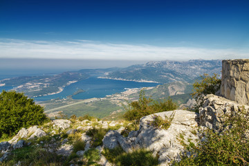 Fototapeta na wymiar Sunrise panoramic morning view of mountain randge and Kotor bay, Montenegro. View from the top of the mountain serpentine.