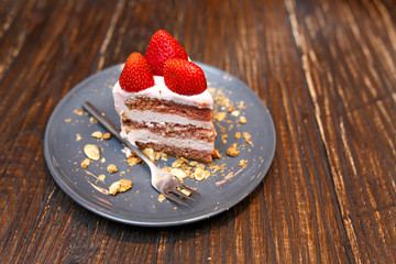 Sweet cakes with summer berries on a wooden table. Party, sweet table. Summer offer desserts in the restaurant.