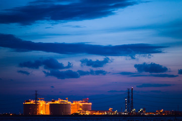 Oil and gas refinery storage in oil refinery petrochemical industry estate, Factory with evening,...