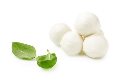 Mini Mozaarella cheese balls with fresh basil leaves isolated on white background. Heap of...